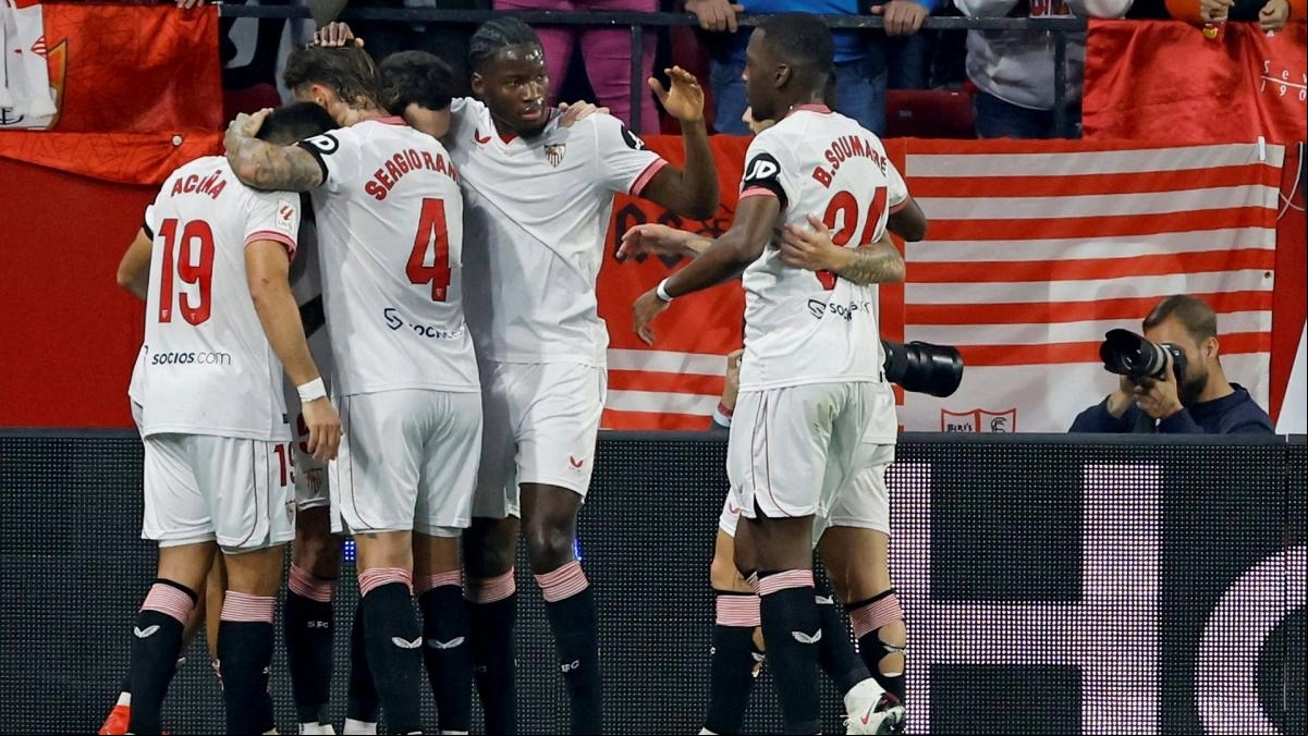 Sevilla players celebrate a goal