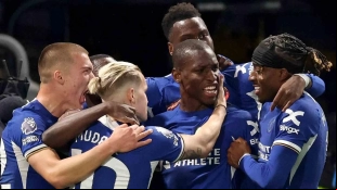 Chelsea players celebrate a goal by Nicolas Jackson.