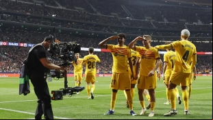 Barcelona players celebrate a goal