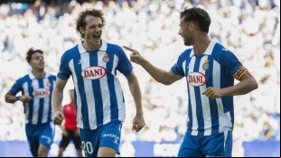 The Espanyol players celebrate a goal.