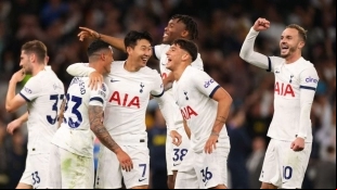 The Tottenham players celebrate a goal.
